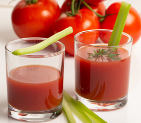 Fresh tomato juice on white background close up