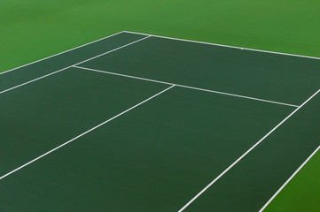 White lines of tennis courts on green floor background and have copy space for design backdrop in...
