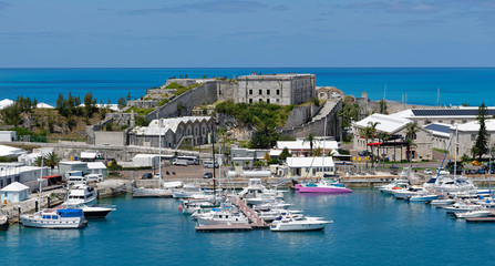 Fototapeta na wymiar Overlook of marina and Royal Naval Dockyard buildings at King's Wharf on Ireland Island, Bermuda