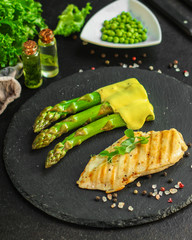 asparagus and meat fillets grill, hollandaise sauce. food background. top