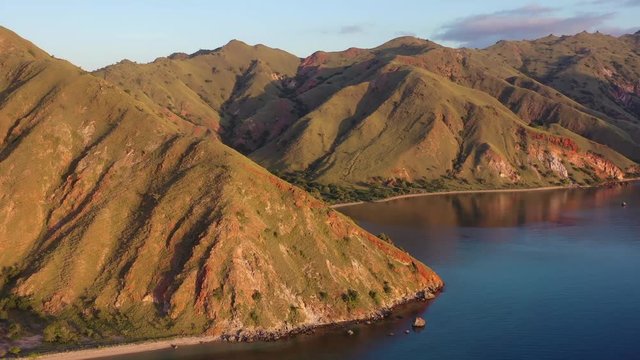Late afternoon light illuminates the scenic coastline of Gili Banta, just outside of Komodo National Park, Indonesia. This tropical area is known for its marine biodiversity.
