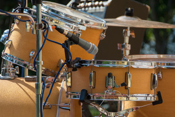yellow drums and gray microphone