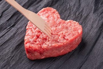 Beautiful juicy meat cutlet on a contrasting black background