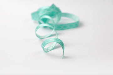 turquoise silk ribbon with on white background