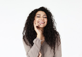 lifestyle, emotion and people concept - young smiling african woman wearing casual over white background