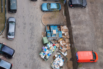 Aerial view urban trash rubbish on the black asphalt city street road car parking place