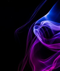 Naklejka premium Colored smoke on black background