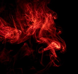 Fototapeta premium Red smoke on black background
