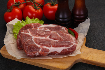 Raw pork neck steak