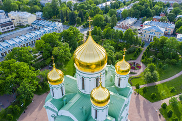 Aerial view of the Orthodox church, cathedral with golden crosses and domes in the city of Pushkin....