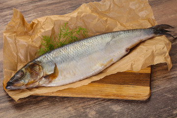 Salted herring over the wooden board
