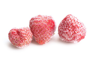 Three frozen strawberries, covered with hoarfrost on a white background...