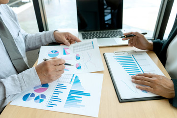 In business office businessman in meeting analyses chart