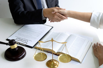 Lawyer or judge  with gavel and balance handshake