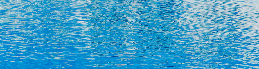 blue water texture in a pool, closeup