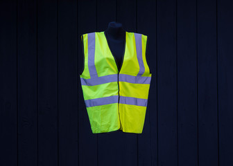 yellow work vest on a mannequin