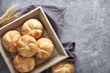 Crusty round bread rolls, known as Kaiser or Vienna rolls on linen towel - obrazy, fototapety, plakaty