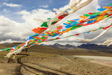 Prayer flags on a windy day in the Himalayas in Tibet