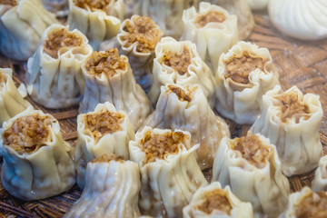 Fototapeta na wymiar Food stand with steamed dumplings in Beijing, capital city of China