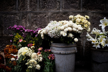 Buckets of Flowers for Sale at Street Market in Guatemala