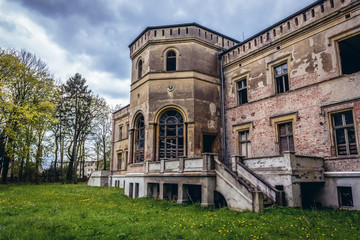 Fototapeta na wymiar Rear view of abandoned mansion in Drezewo, small village near Baltic Sea coast in West Pomerania region in Poland