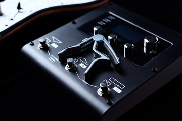 Multieffects Processor for Electric Guitar on black background. 