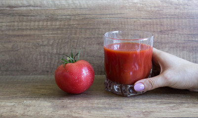 Refreshing tomato juice. A glass of Tomato Fresh