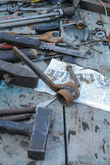 Old rusty tools on the table.