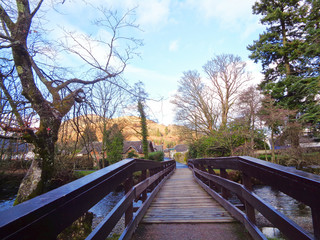 Fototapeta na wymiar Wooden bridge over the river