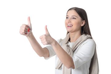 Portrait of beautiful young woman with long hair showing thumbs up