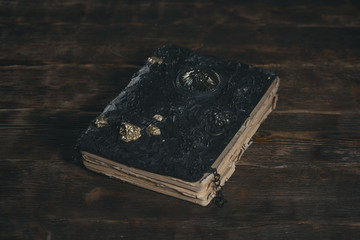 Book of magic on the magician table. Witchcraft.