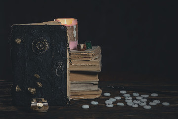 Runes for divination and magic book on fortune teller desk table background. Futune reading concept.