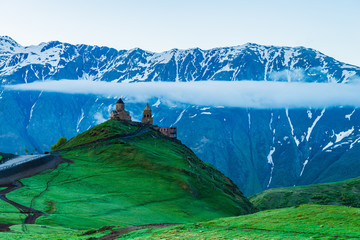 The old church of the Holy Trinity at dawn in the mountains of Georgia. Church 7th century AD
