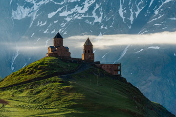 The old church of the Holy Trinity at dawn in the mountains of Georgia. Church 7th century AD