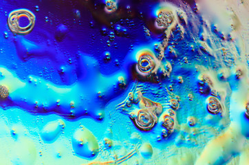 Beautiful colorful background, neon lights, bubbles, stains. Macro