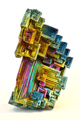 Bismuth crystals isolated on white. This is the most strongly diamagnetic element and also the heaviest that is not radioactive.