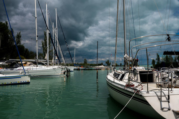 Naklejka premium Modern Sailboats In Harbor At Stormy Weather