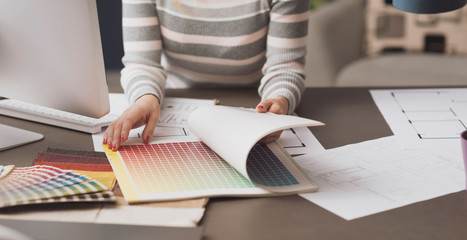 Professional designer searching color swatches