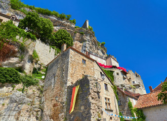 Foreground view of the houses and buildings built on the cliff of the valley in the medieval french village of Rocamadour, Lot Department, Quercy, Occitanie Region, France. UNESCO world heritage site.