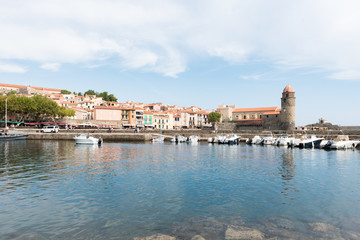 Fototapeta na wymiar Old town of Collioure, France, a popular town on Mediterranean sea, view of the habor and church