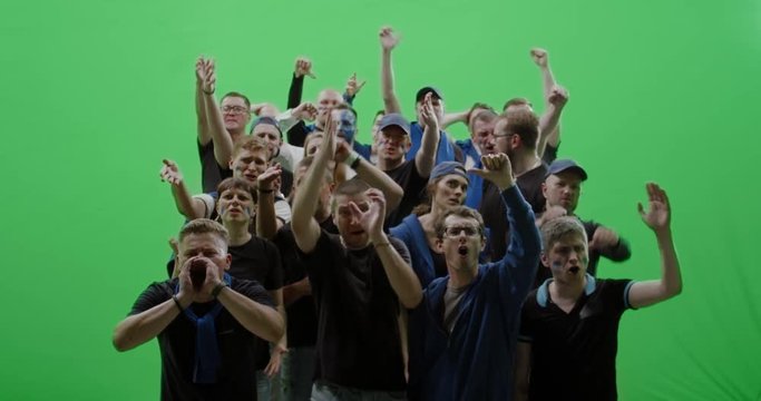 GREEN SCREEN CHROMA KEY Front view group of people fans wearing blue clothes are outraged during a sport event. 4K UHD ProRes 422 HQ