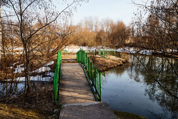 Bridge over small river in a nice sunny day in early spring