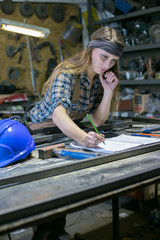 portrait of young woman working in a workshop