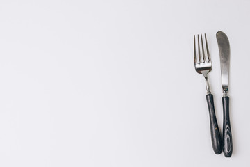 Fork and knife on white background.