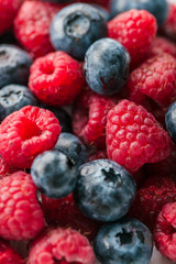 Fresh Summer Berries mix Background with Strawberry, Raspberry, Red currant, Blueberry and Blackberry.