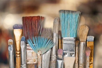 Artist paint brushes and paint cans