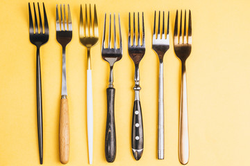 Forks on yellow background