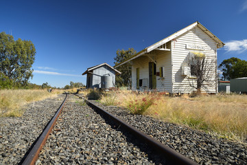 Fototapeta na wymiar Rail tracks lead through small country railway station, Toobeah Qld Australia.