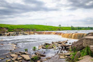 Sablinsky waterfalls. Little waterfall. The brown water of the waterfall.. Thresholds on the river. Strong water flow. Jets of water.