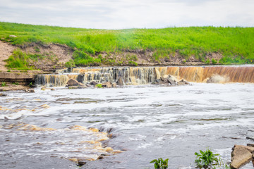 Sablinsky waterfalls. Little waterfall. The brown water of the waterfall.. Thresholds on the river....